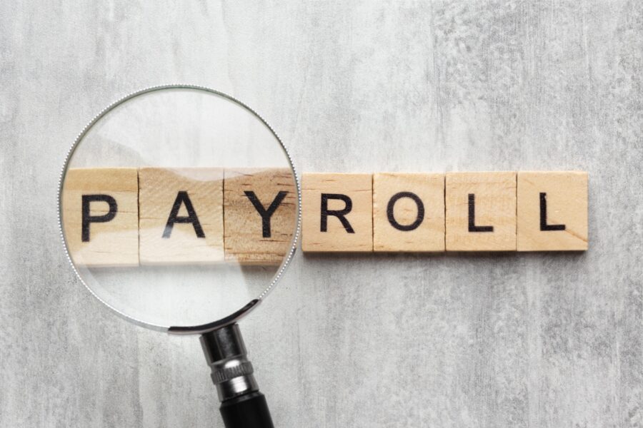 top view payroll concept with wooden cubes